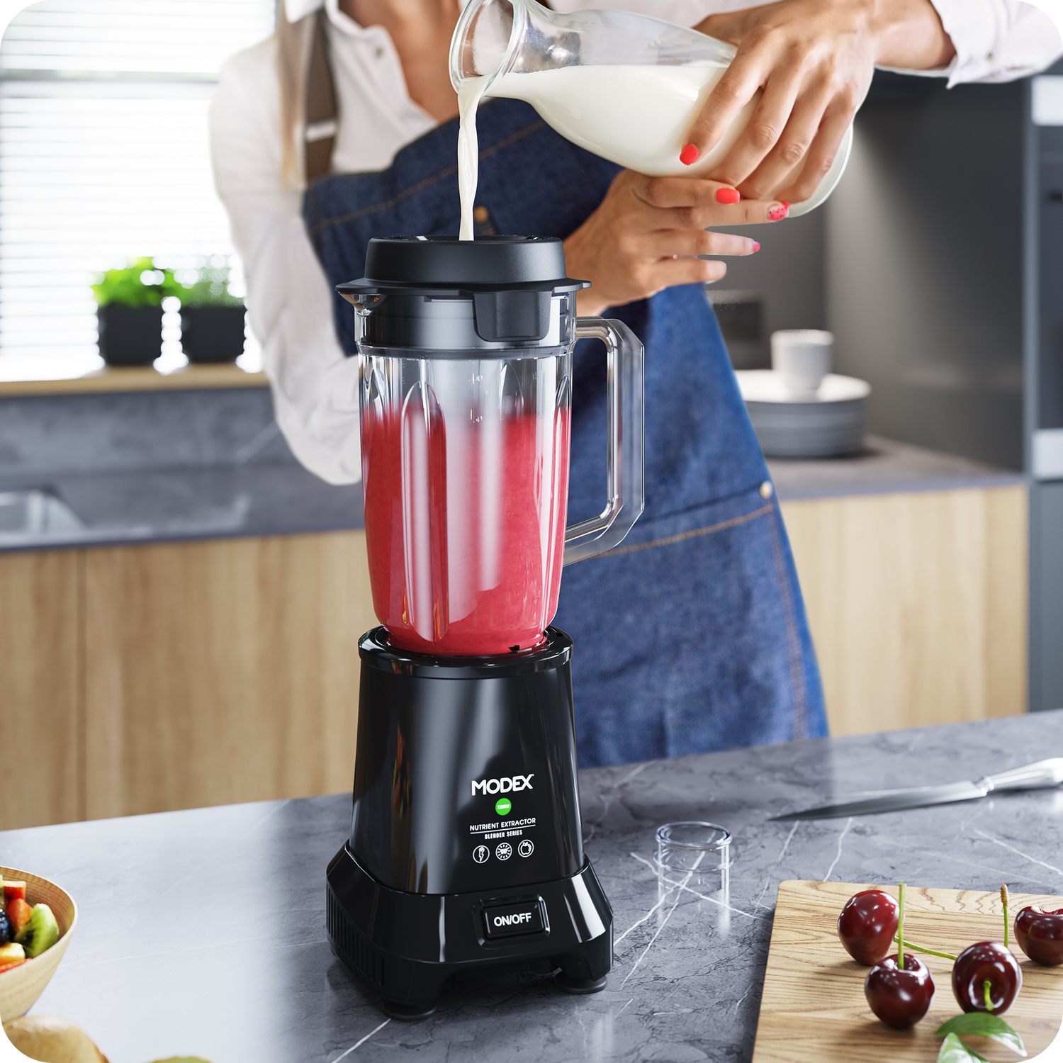 Milk being poured into the MODEX BL911 blender jar while preparing a fruit smoothie.