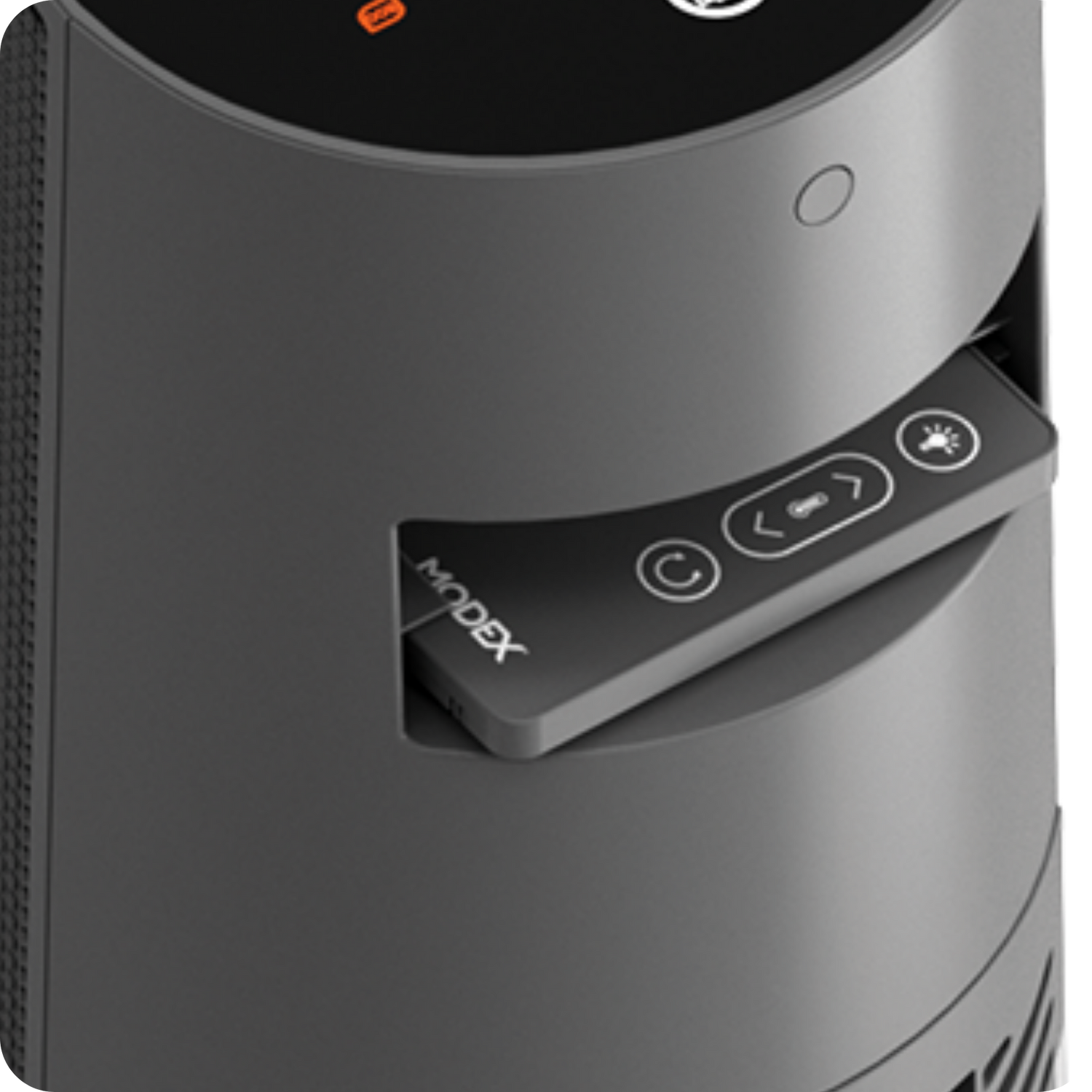 Close-up of the MODEX PTC6500 built-in remote control storage slot with the remote partially inserted into the heater body.
