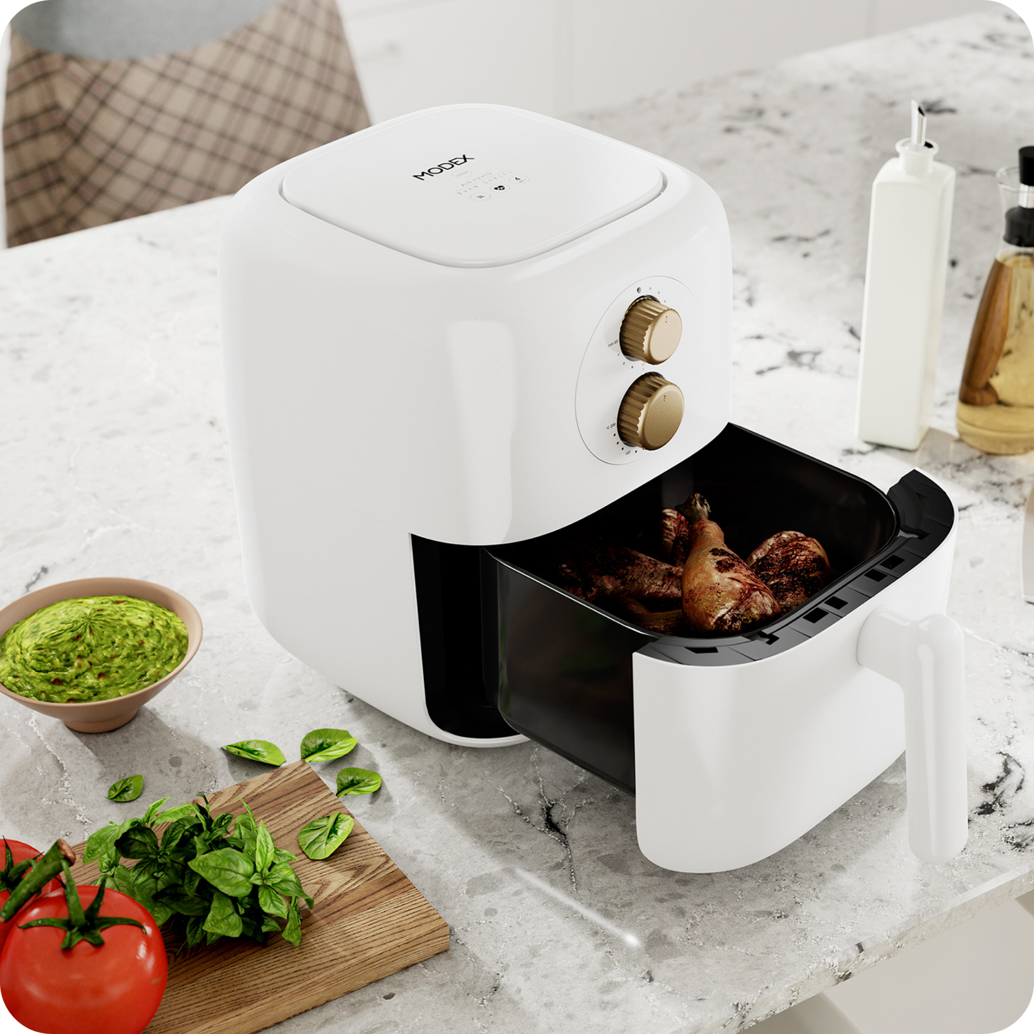 White and black air fryer on a kitchen counter with food inside