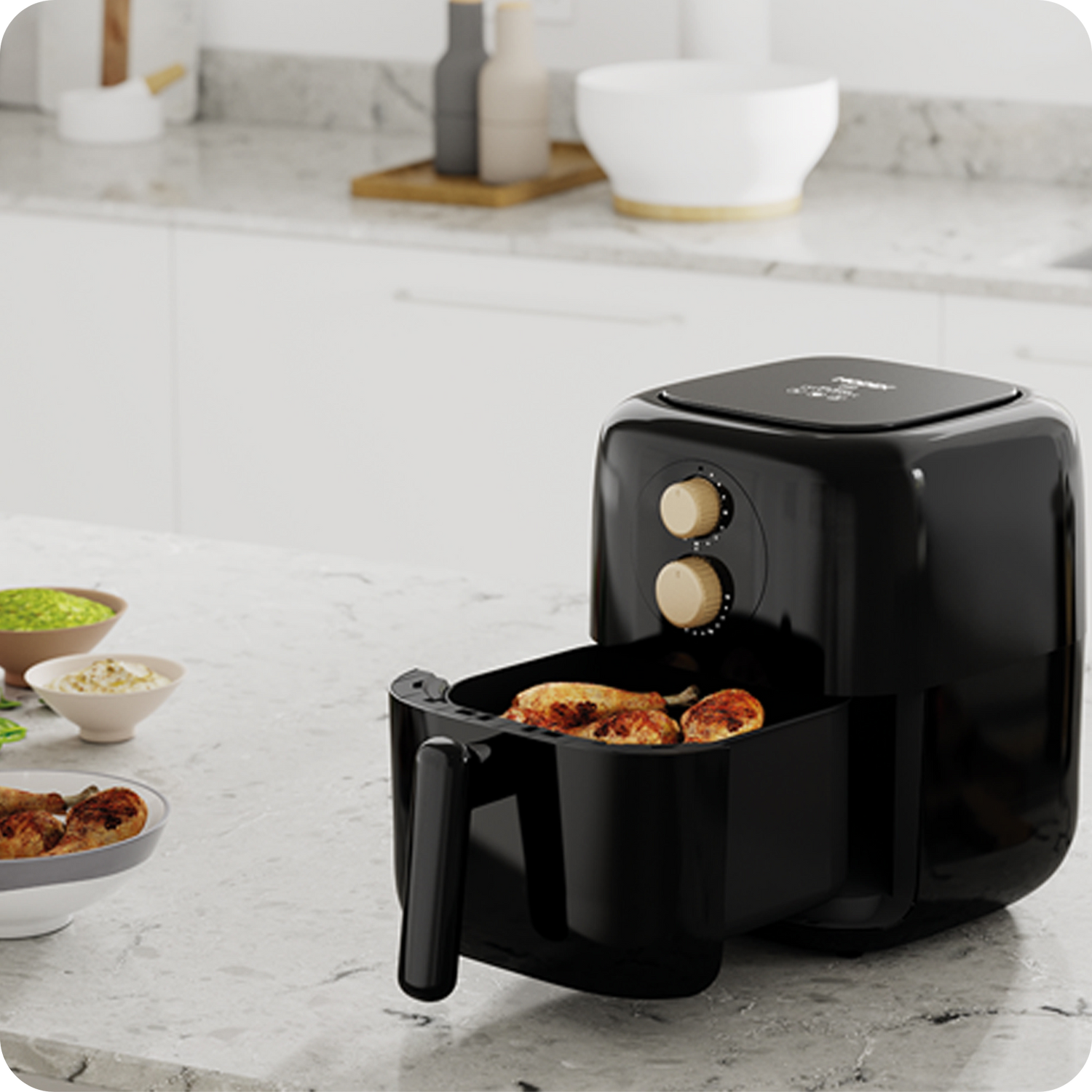 Black air fryer on a kitchen counter with food inside