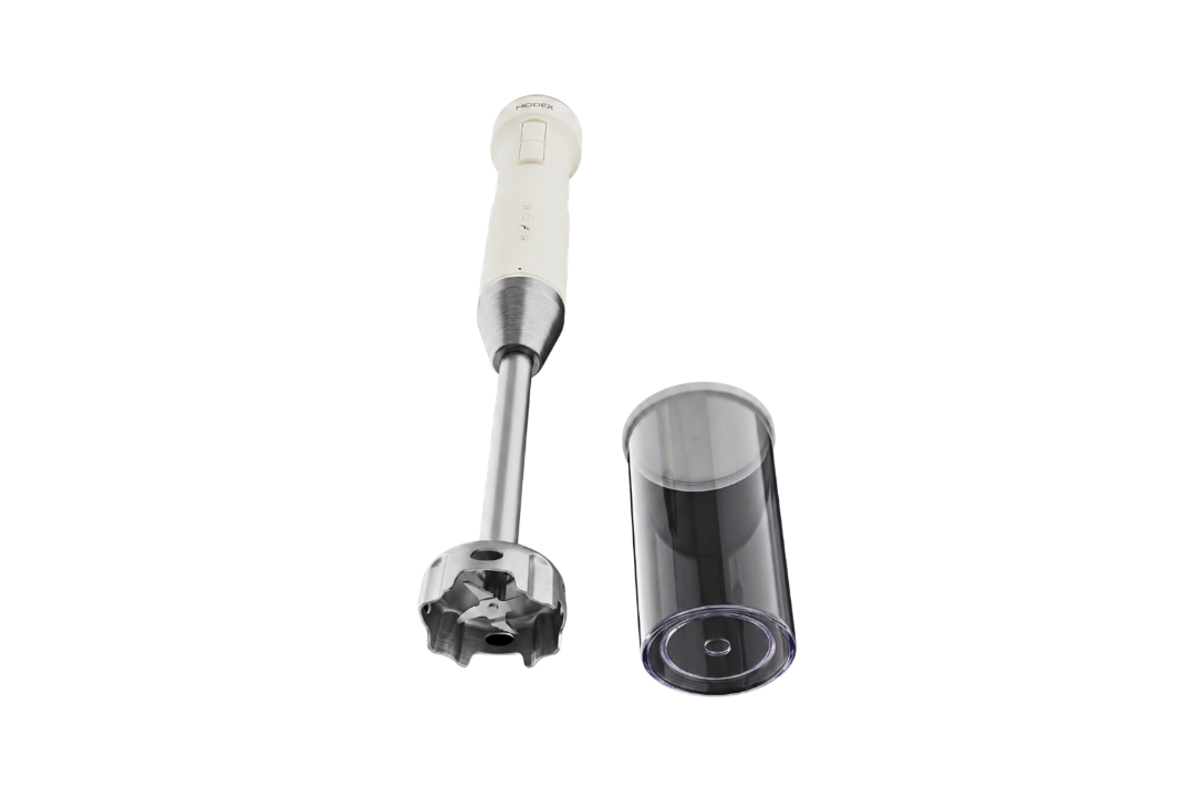 Handheld blender with attachments on a white background