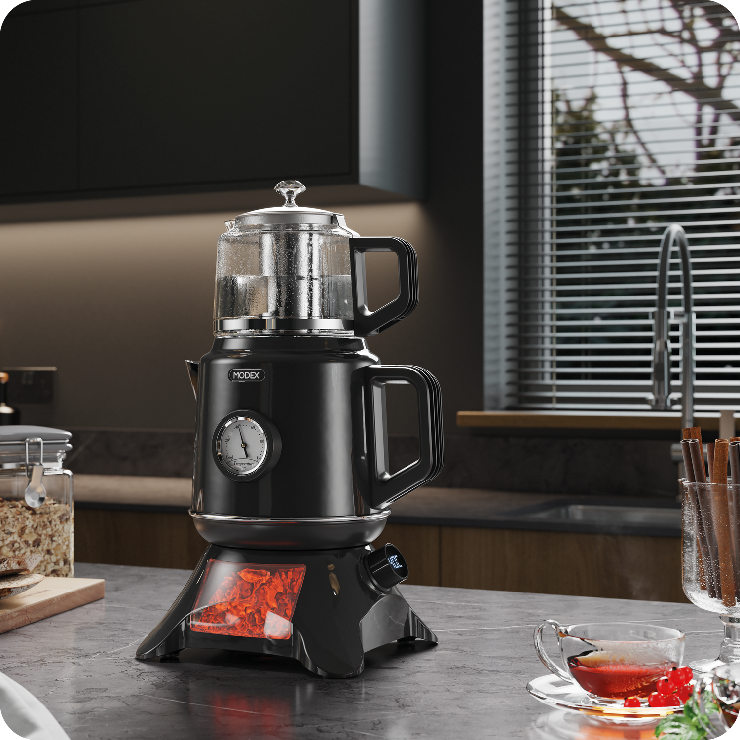 TCS8010 Modex tea maker in black with separate glass teapot, front temperature gauge, illuminated base, and breakfast setting in a modern kitchen