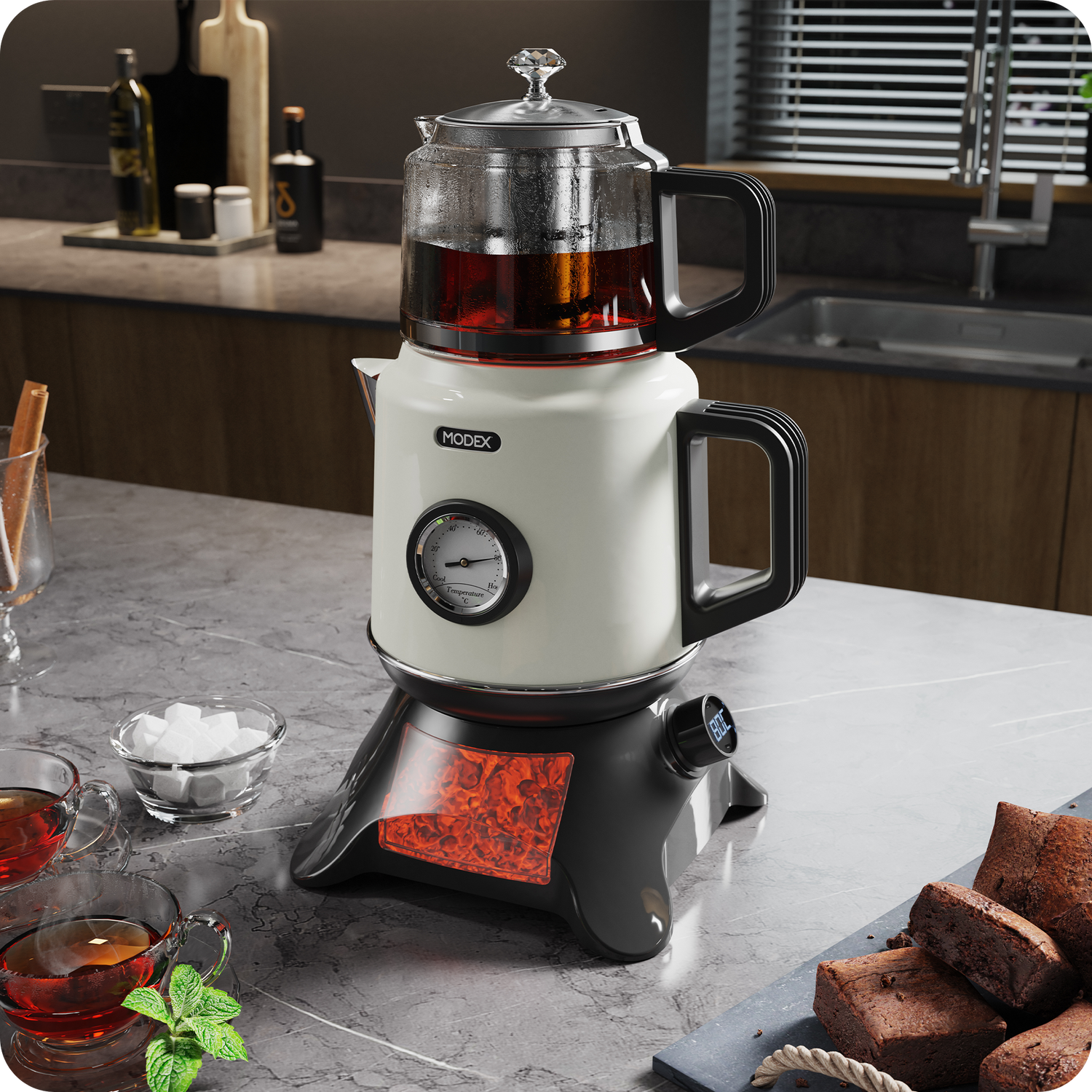 TCS8010 Modex tea maker in cream and black with glass teapot, analog temperature gauge, glowing base, and tea cups on a kitchen counter